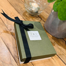 Load image into Gallery viewer, A gift box containing four varieties of organic tea in glass test tubes
